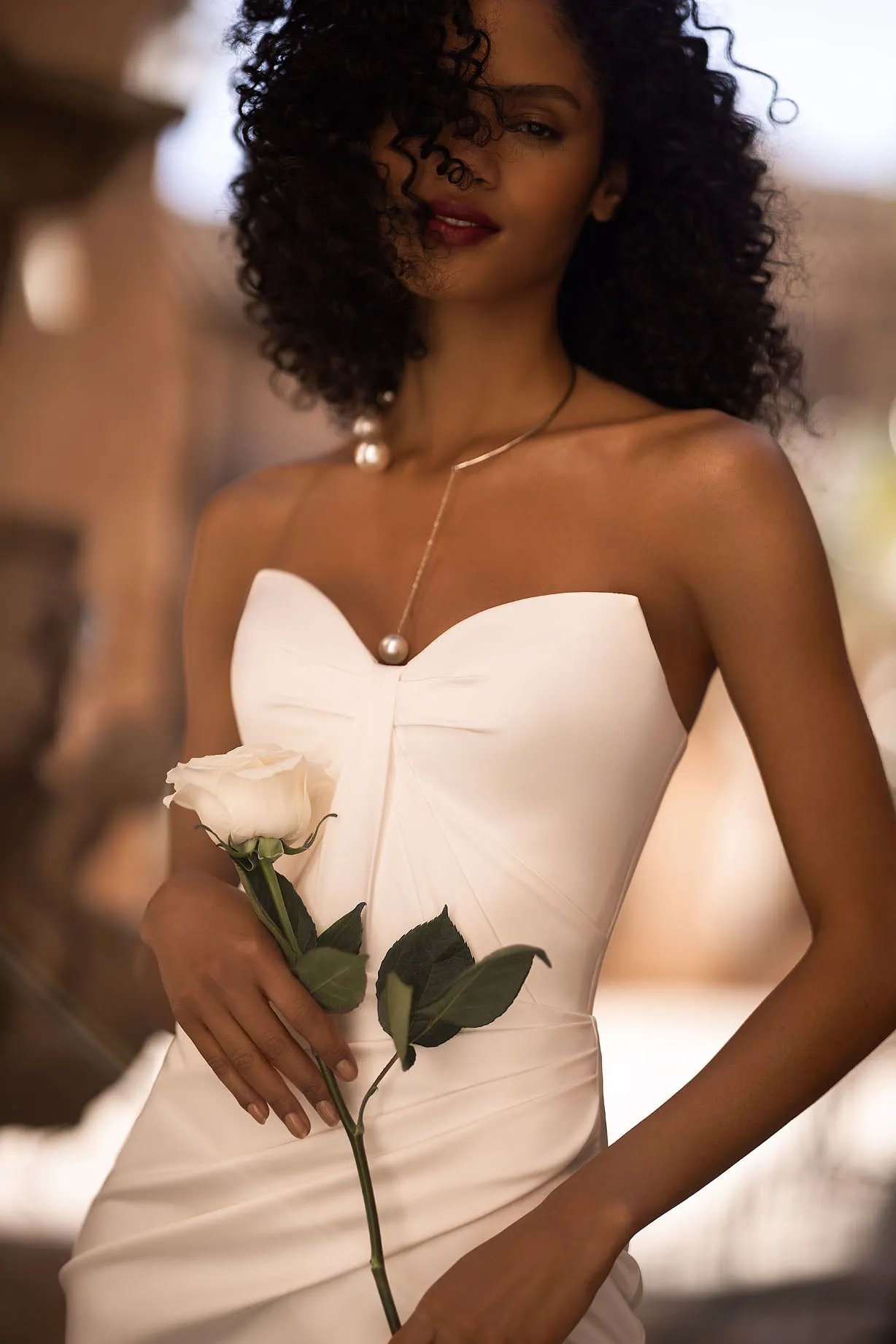 Introducing our exquisite mermaid wedding dress, a stunning masterpiece of elegance and allure. Crafted from luxurious glossy fabric, it exudes a lustrous sheen that commands attention and captures the light with every movement. - Image 2