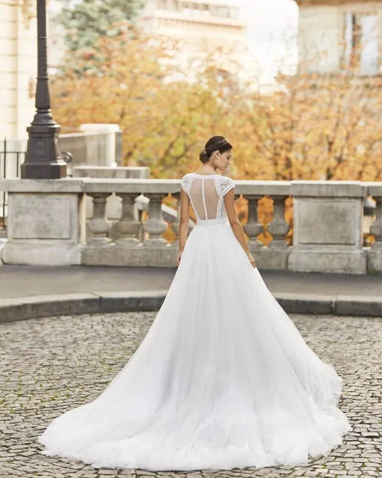 Charming A-Line Wedding Gown with Cap Sleeves, Elegant V-Neckline, and Delicate Lace Detailing for a Graceful Bridal Look - Image 2
