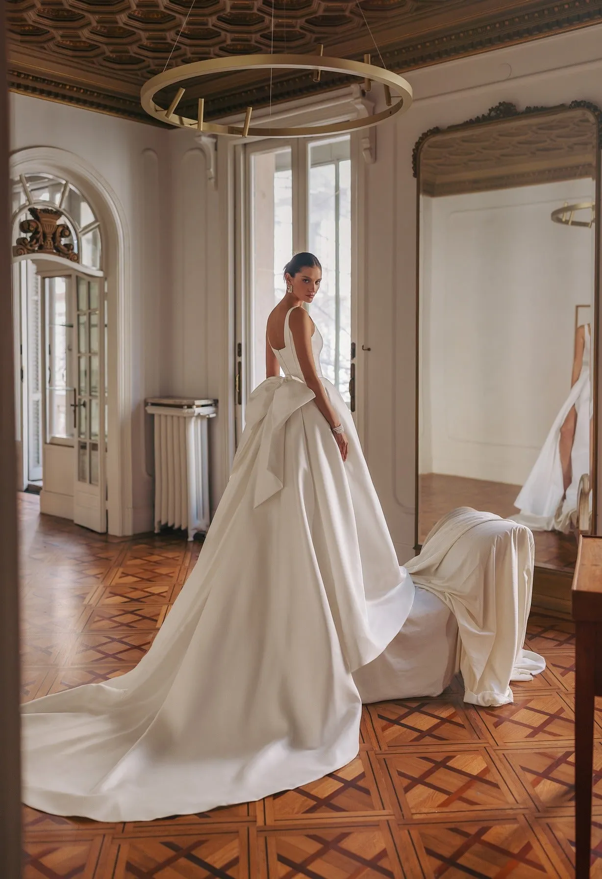 strapped dress with smooth rectangular neckline and simple lines. The bottom is a split gown-like skirt featuring a detachable wide ribbon bow. - Image 2