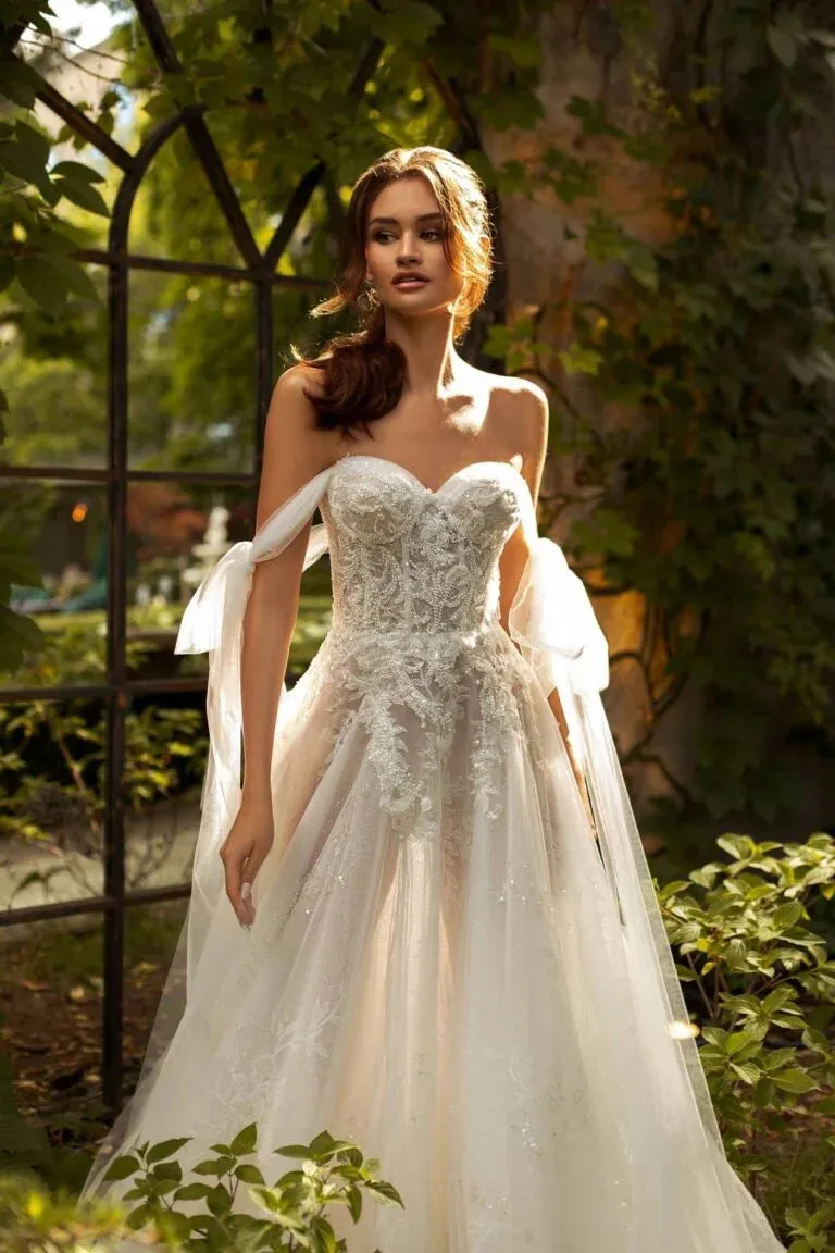Elegant A-Line Wedding Gown with Off-Shoulder Neckline, Delicate Beaded Lace Details, and a Flattering Dropped Waist for a Breathtaking Bridal Look - Image 3