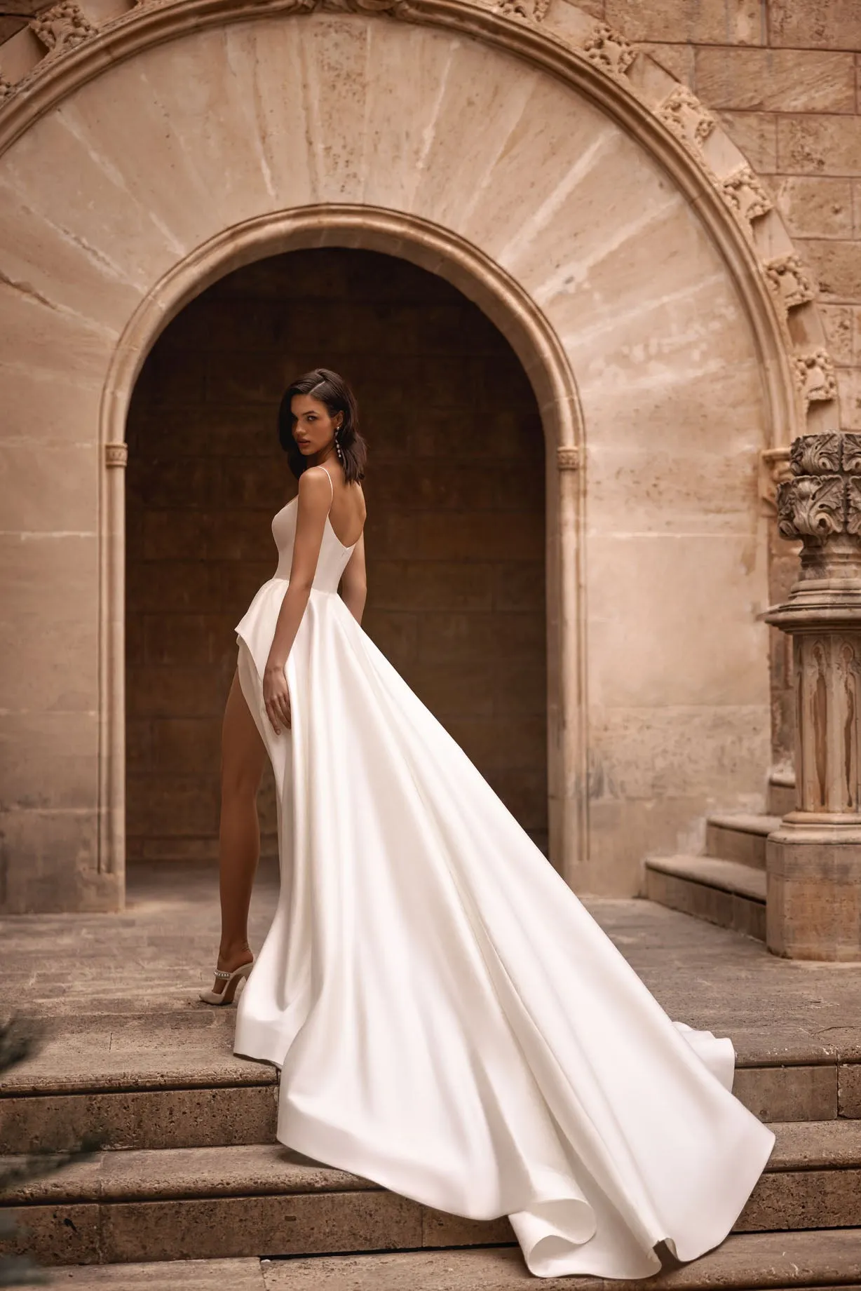 gnite the atmosphere with our mesmerizing A-line wedding dress, a true embodiment of glamour and allure - Image 3