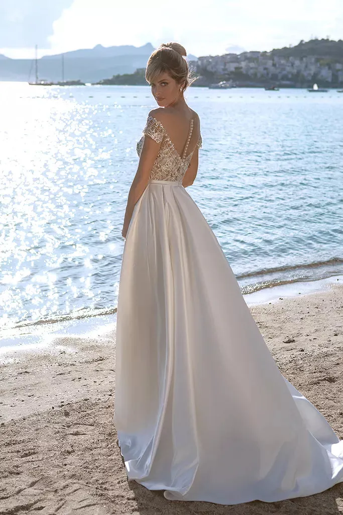 Ethereal A-Line Wedding Gown with Delicate Cap Sleeves, a Romantic Off-Shoulder Neckline, for a Timeless and Enchanting Bridal Look - Image 3