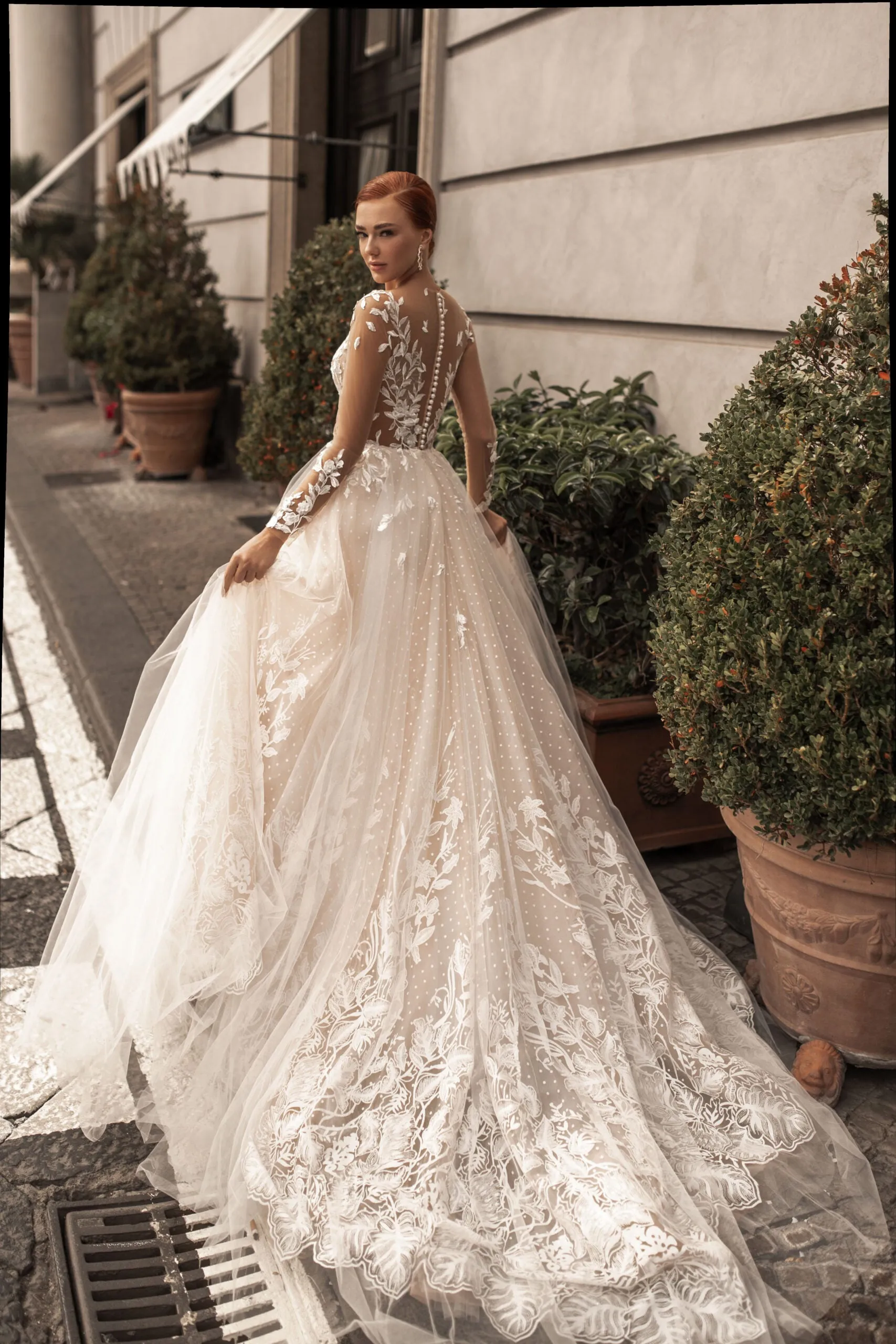 Ethereal A-Line Wedding Gown with Illusion Sleeves, Button Detailing, and a Romantic Puffy Silhouette - Image 2