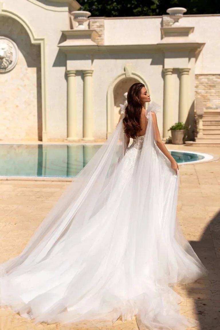 Ethereal A-Line Wedding Gown with Spaghetti Straps, V-Neckline, and a Graceful Dropped Waist for a Romantic Bridal Look - Image 2