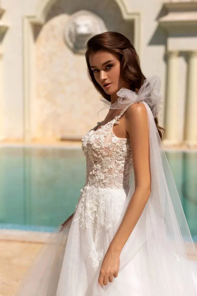 Ethereal A-Line Wedding Gown with Spaghetti Straps, V-Neckline, and a Graceful Dropped Waist for a Romantic Bridal Look - Image 3
