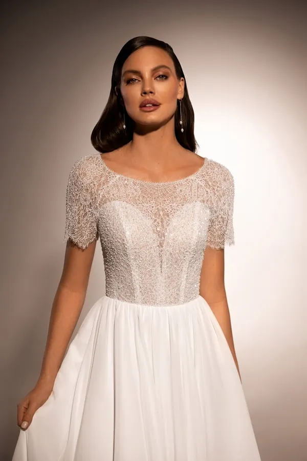 Graceful A-Line Wedding Gown with Boat Neckline and Corset Detail - Image 4