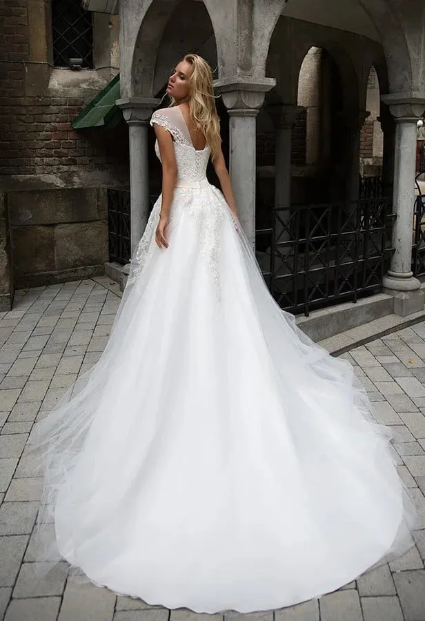 Graceful A-Line Wedding Gown with Strapless Illusion Neckline, Delicate Lace Detailing, and a Flattering Dropped Waist for an Enchanting Bridal Look - Image 2