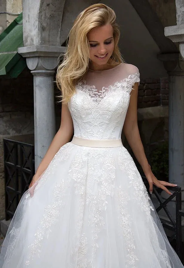Graceful A-Line Wedding Gown with Strapless Illusion Neckline, Delicate Lace Detailing, and a Flattering Dropped Waist for an Enchanting Bridal Look - Image 3