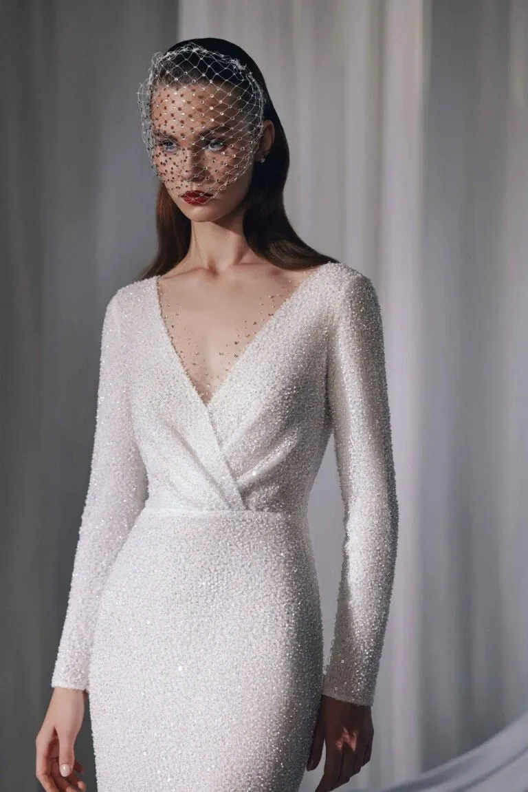 Graceful Minimalist A-Line Bridal Gown with Long Sleeves, V-Neckline, Lace Embellishments, and Natural Waistline for a Stunning Look - Image 2