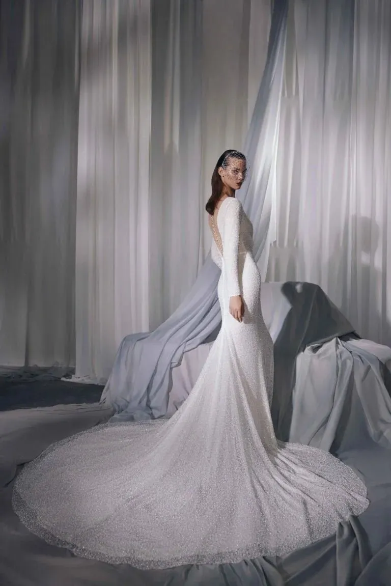 Graceful Minimalist A-Line Bridal Gown with Long Sleeves, V-Neckline, Lace Embellishments, and Natural Waistline for a Stunning Look - Image 3