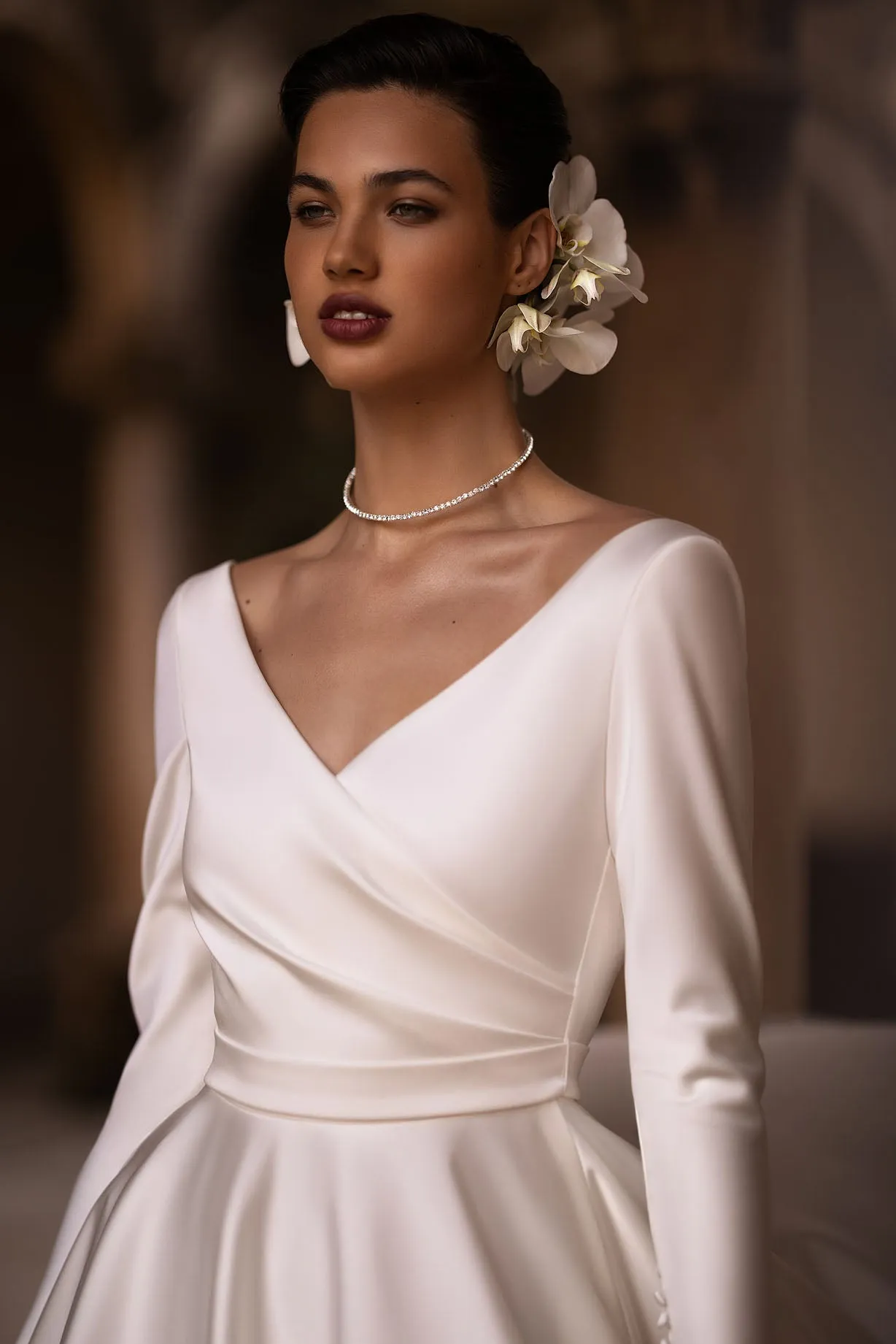 Introducing our exquisite A-line wrap wedding dress, a harmonious blend of modernity and classic elegance. Crafted from luxurious glossy fabric, it drapes gracefully to accentuate your silhouette with a sense of refined beauty. - Image 2