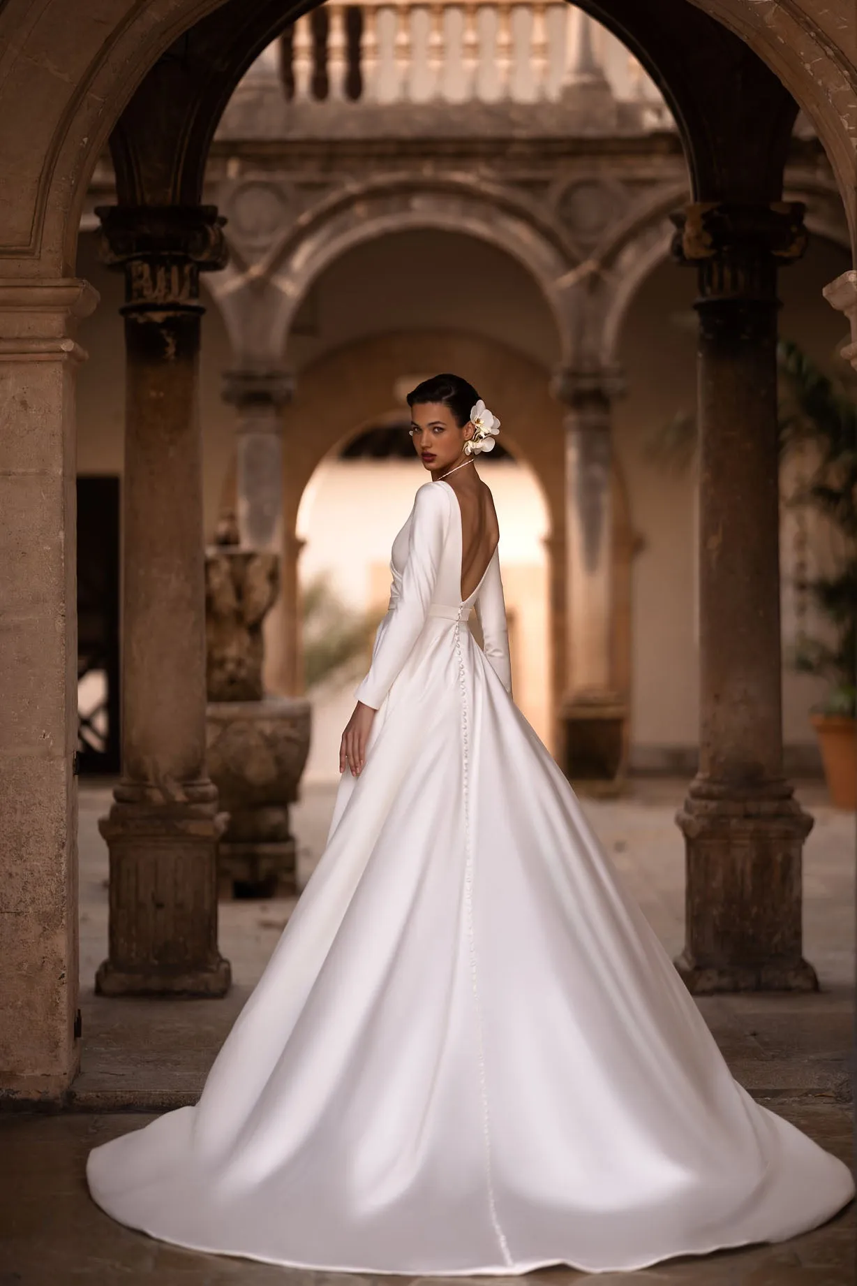 Introducing our exquisite A-line wrap wedding dress, a harmonious blend of modernity and classic elegance. Crafted from luxurious glossy fabric, it drapes gracefully to accentuate your silhouette with a sense of refined beauty. - Image 3