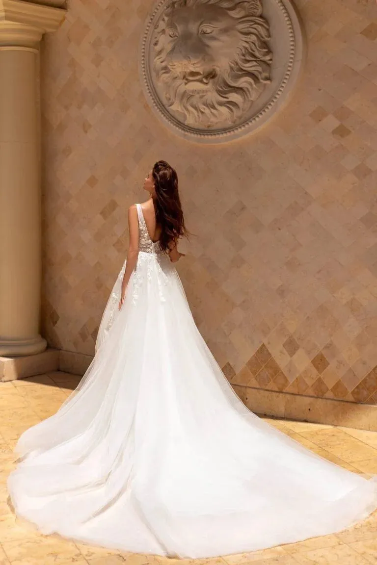 Majestic Ball Gown Wedding Dress with Cap Sleeves, V-Neckline, and a Flattering Dropped Waist for a Fairytale Bridal Look - Image 2