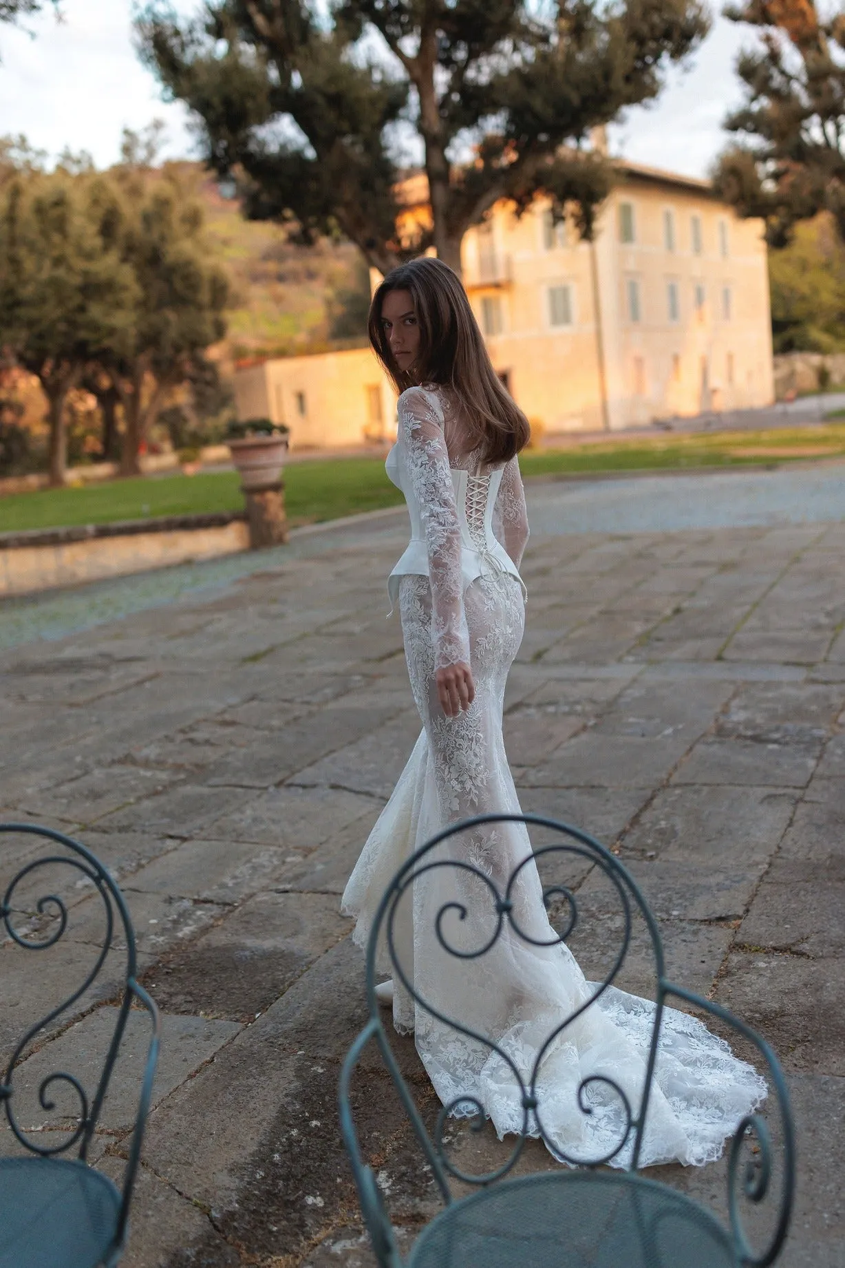 Meticulously detailed embroidery over the translucent long sleeve top and smooth mermaid tail skirt. - Image 4