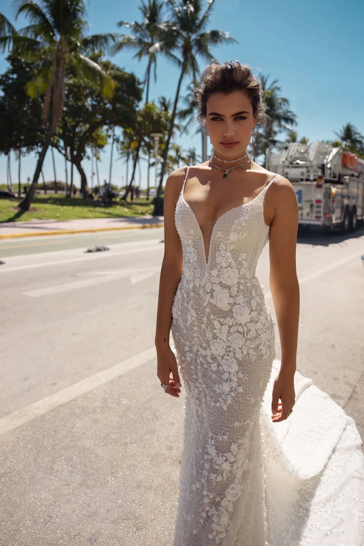 Bloom into a breathtaking bride in this floral lace mermaid wedding dress with a V-neckline and straps. The exquisite lace embellishments embrace your figure, flowing into a dramatic train, leaving a lasting impression on your big day. - Image 4