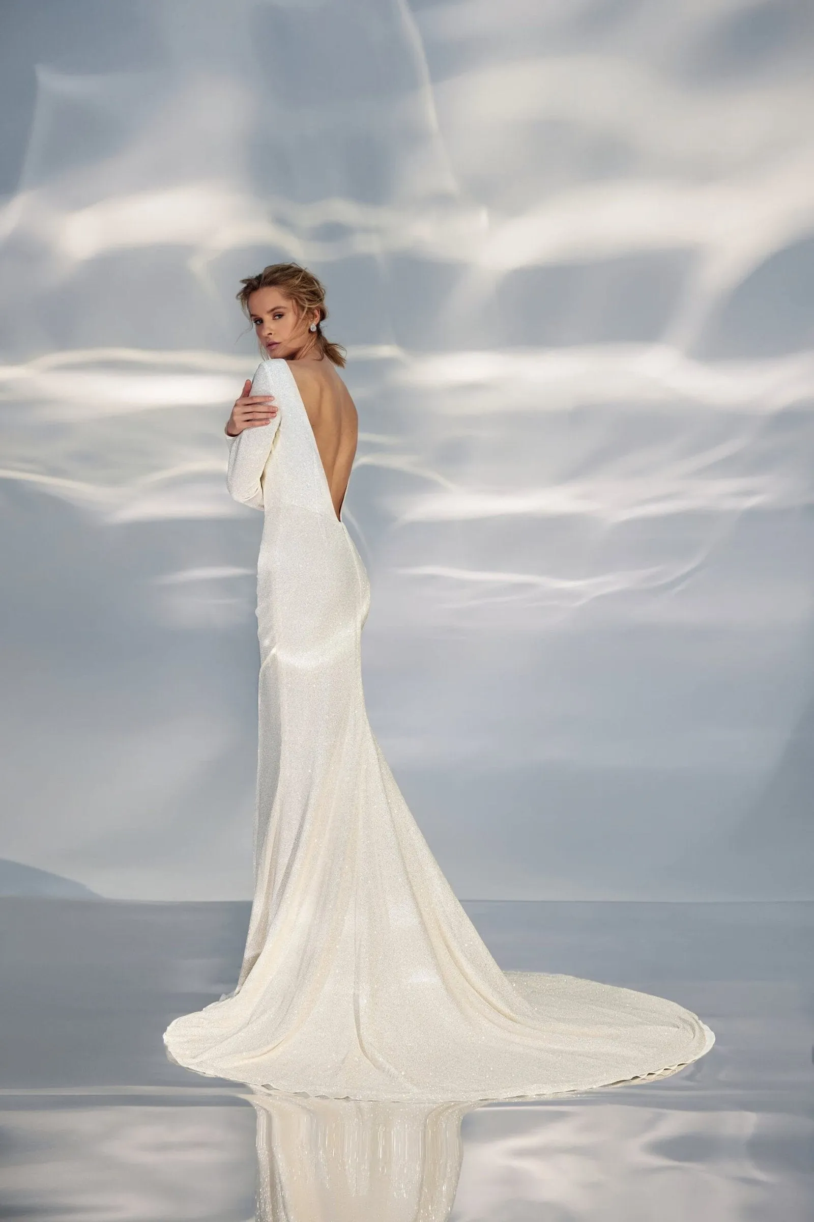 Sleek A-Line Wedding Gown with Long Sleeves, Boat Neckline, and a Natural Waistline for a Minimalist and Elegant Bridal Look - Image 3