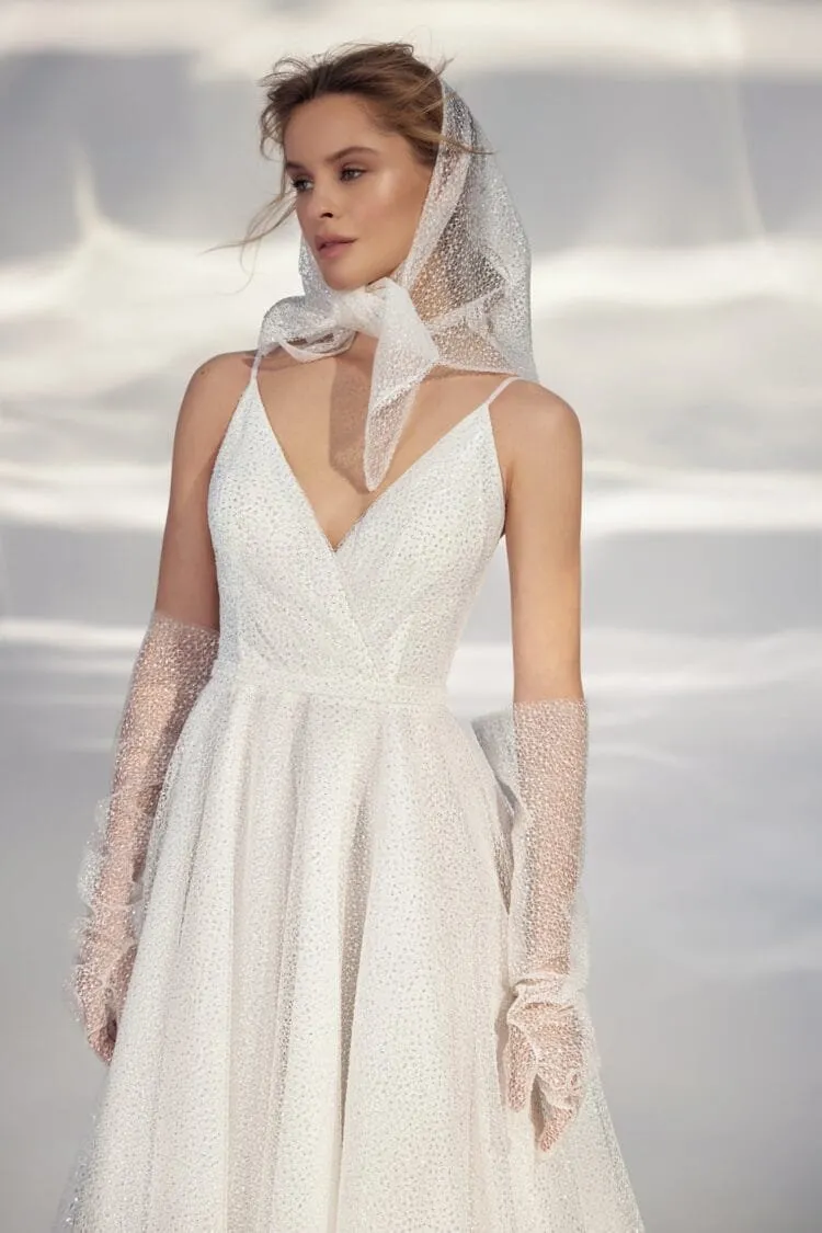 Sleek A-Line Wedding Gown with Straps, V-Neckline, Delicate Lace Embellishment, and a Natural Waistline for a Minimalist and Elegant Bridal Look - Image 2