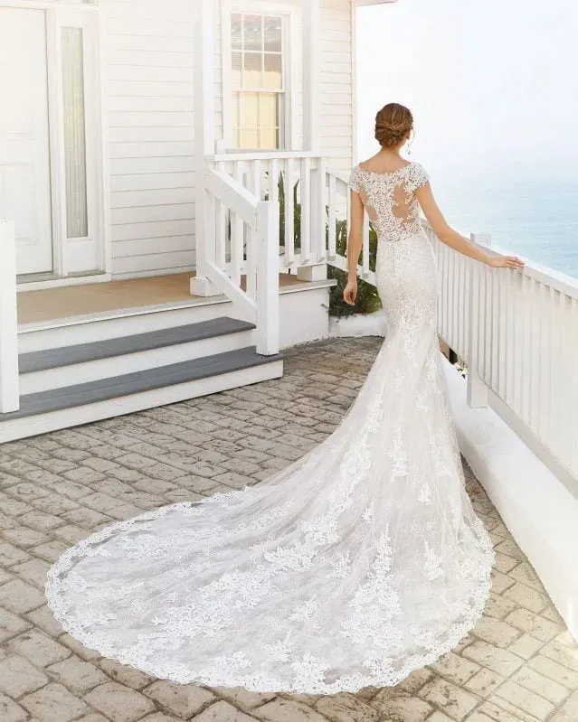 Sophisticated Mermaid Wedding Gown with Cap Sleeves, Elegant V-Neckline, and Exquisite Lace Detailing for a Timeless and Captivating Bridal Look - Image 2