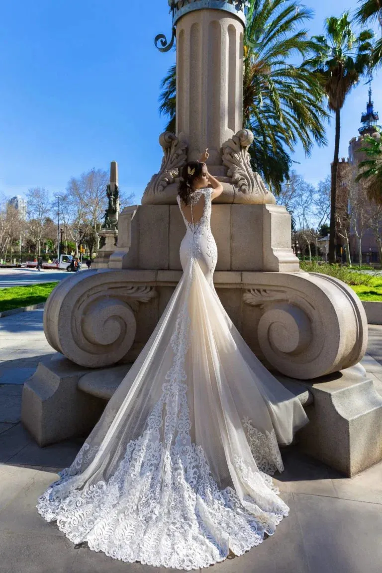 Sophisticated Mermaid Wedding Gown with Cap Sleeves, V-Neckline, and a Flattering Natural Waist for a Glamorous Bridal Look - Image 2