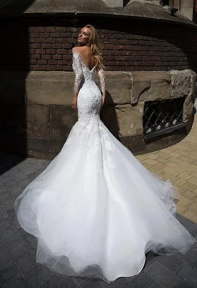 Sophisticated Mermaid Wedding Gown with Long Sleeves, Elegant Boat Neckline, and Exquisite Lace Detailing for a Timeless and Regal Bridal Look - Image 2