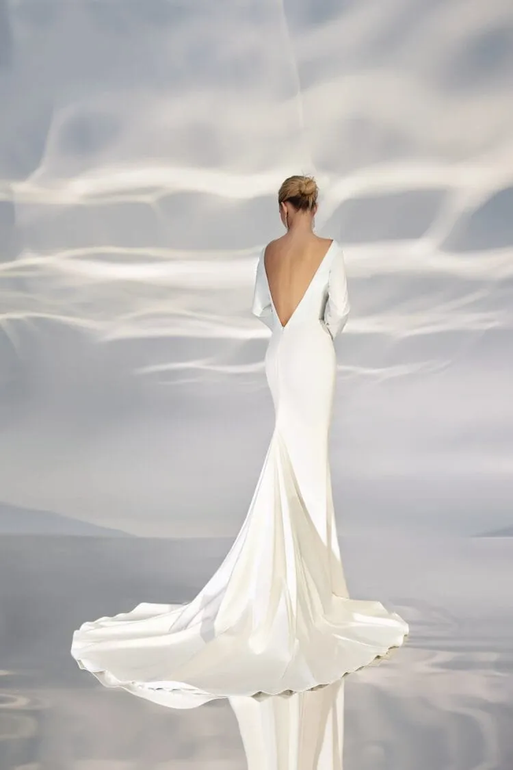 Sophisticated Minimalist A-Line Wedding Gown with Long Sleeves, Boat Neckline, and a Natural Waistline for an Elegant and Timeless Bridal Look - Image 2