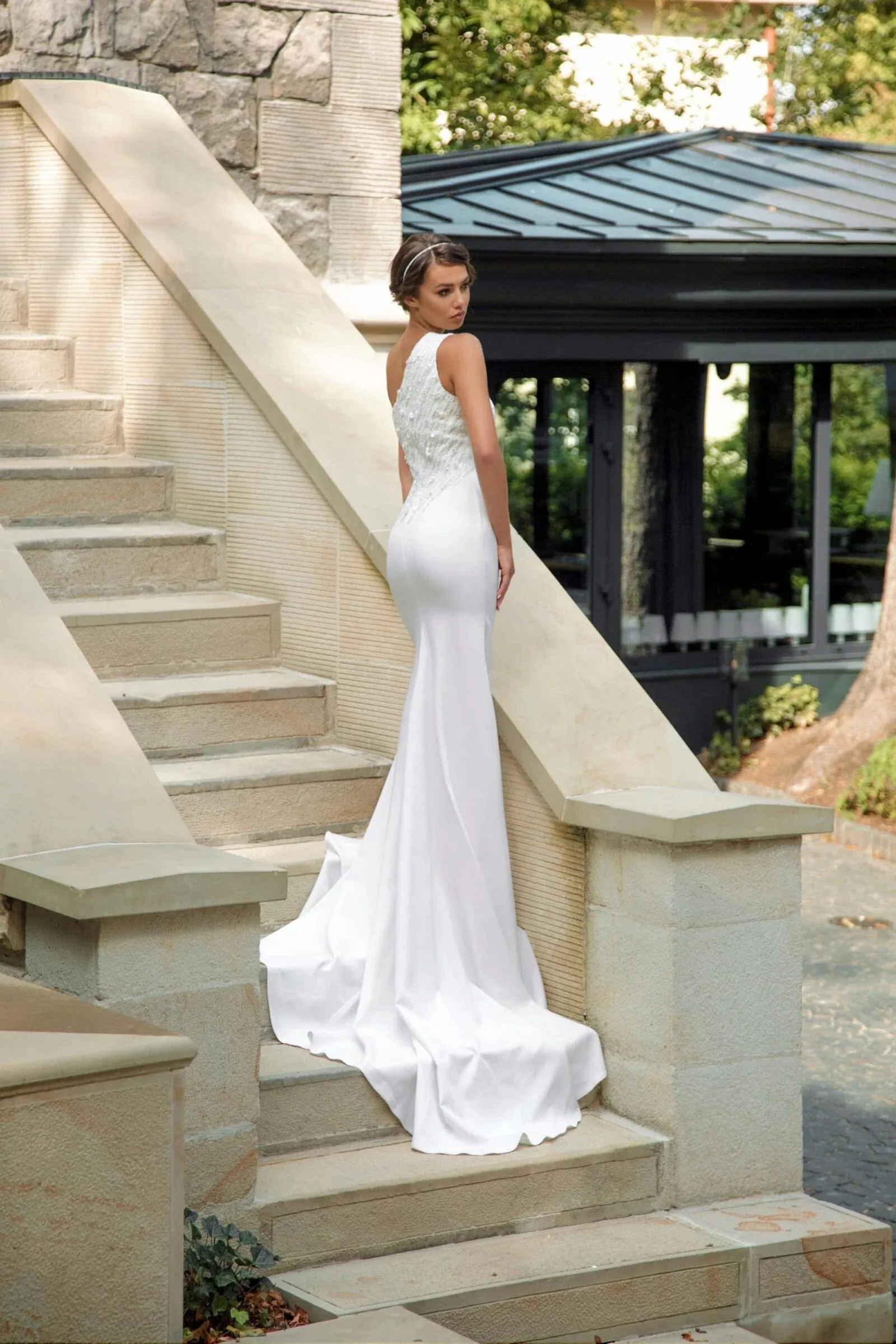 Sophisticated Minimalist Mermaid Wedding Dress with Asymmetric Neckline, Delicate Straps, and Elegant Lace Embellishments - Image 2