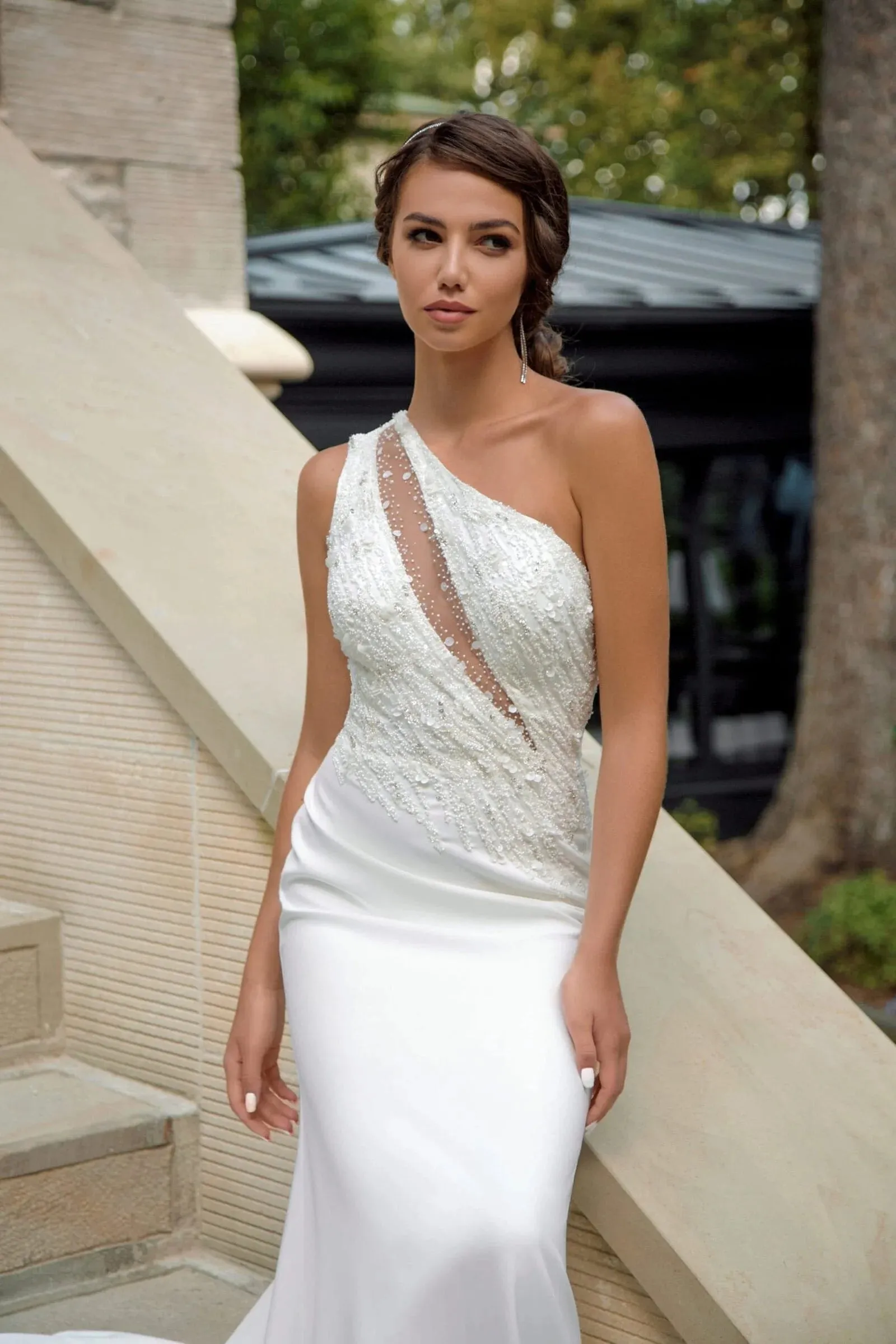 Sophisticated Minimalist Mermaid Wedding Dress with Asymmetric Neckline, Delicate Straps, and Elegant Lace Embellishments - Image 3