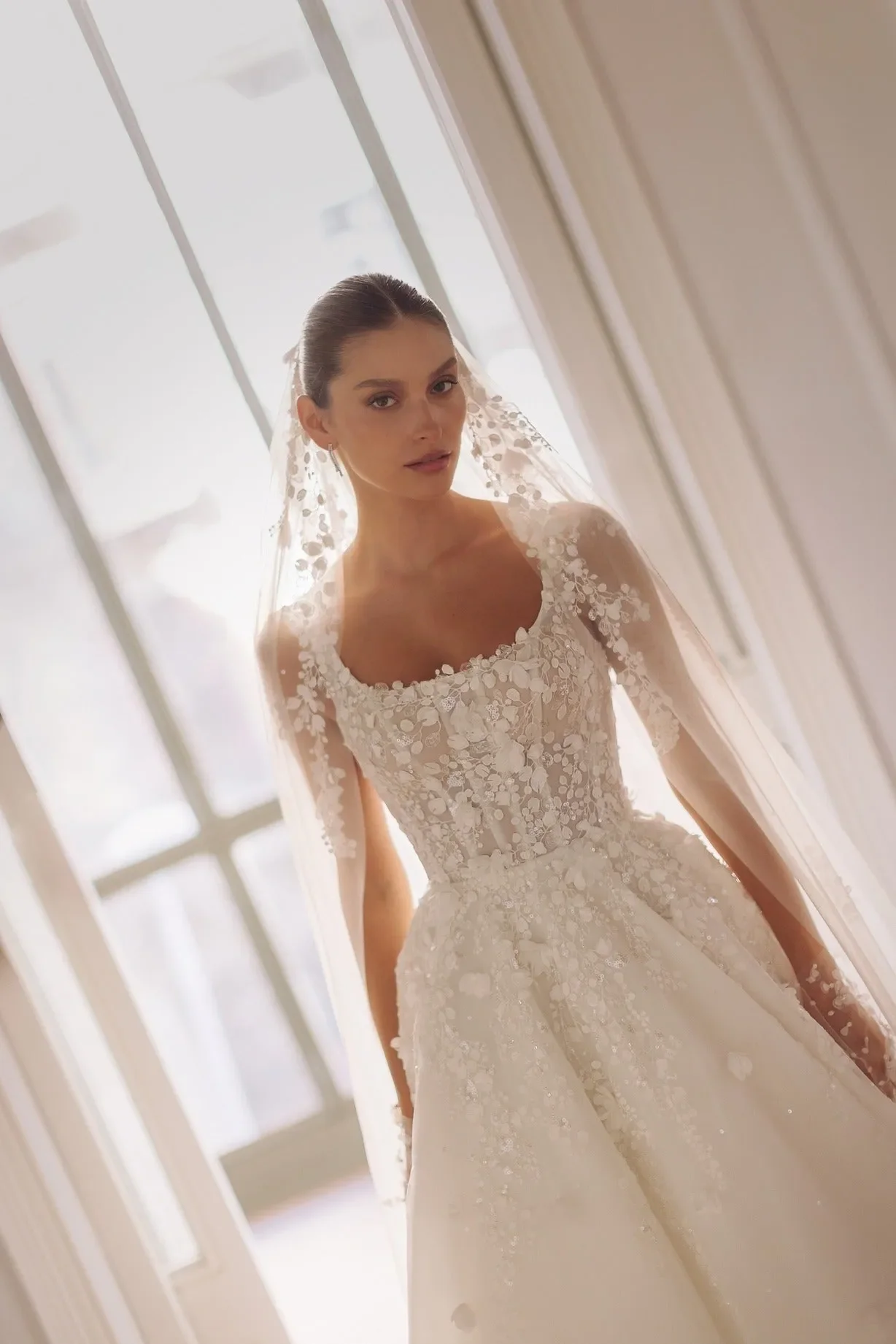 Round neck sleeveless corset-based dress with meticulous embroideries on the top a detachable embroidered veil. - Image 2