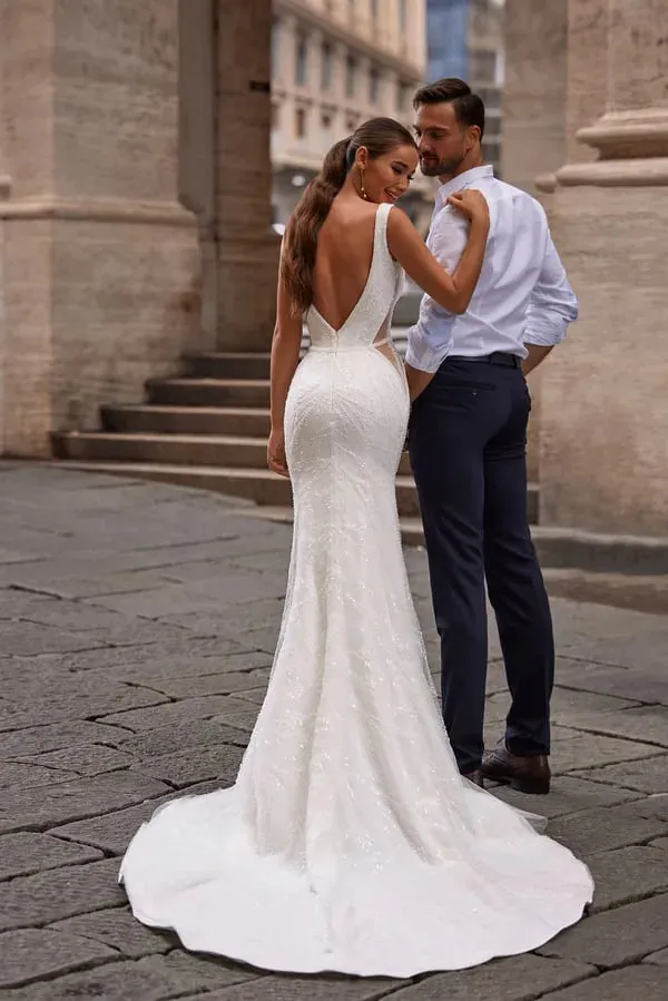 Stunning Mermaid Wedding Dress with Sleeveless Design, Deep Neckline, and Elegant Sequined Embellishments - Image 2