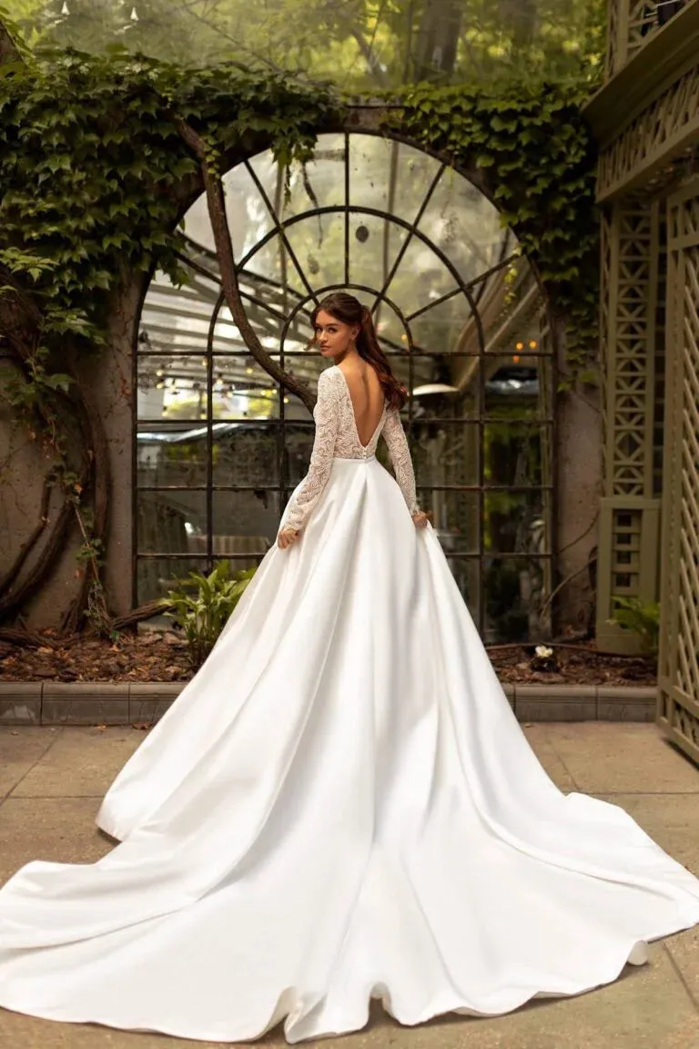 Timeless A-Line Wedding Gown with Long Sleeves, V-Neckline, and a Flattering Dropped Waist for an Elegant Bridal Look - Image 2